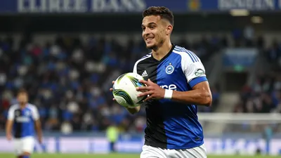 A photorealistic image of a young, anonymous Club Brugge player, aged 18-20, in a blue-black kit with white sleeves and...